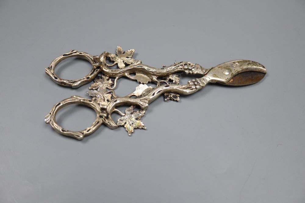 A pair of Continental silver grape scissors, a cased set of six silver cake forks and sundry items